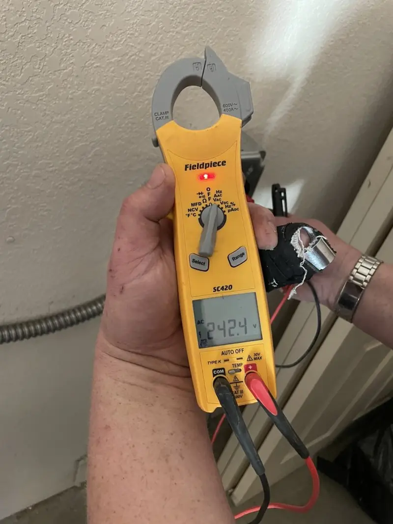 Voltage testing with clamp meter during Recessed Lighting Installation in Concord